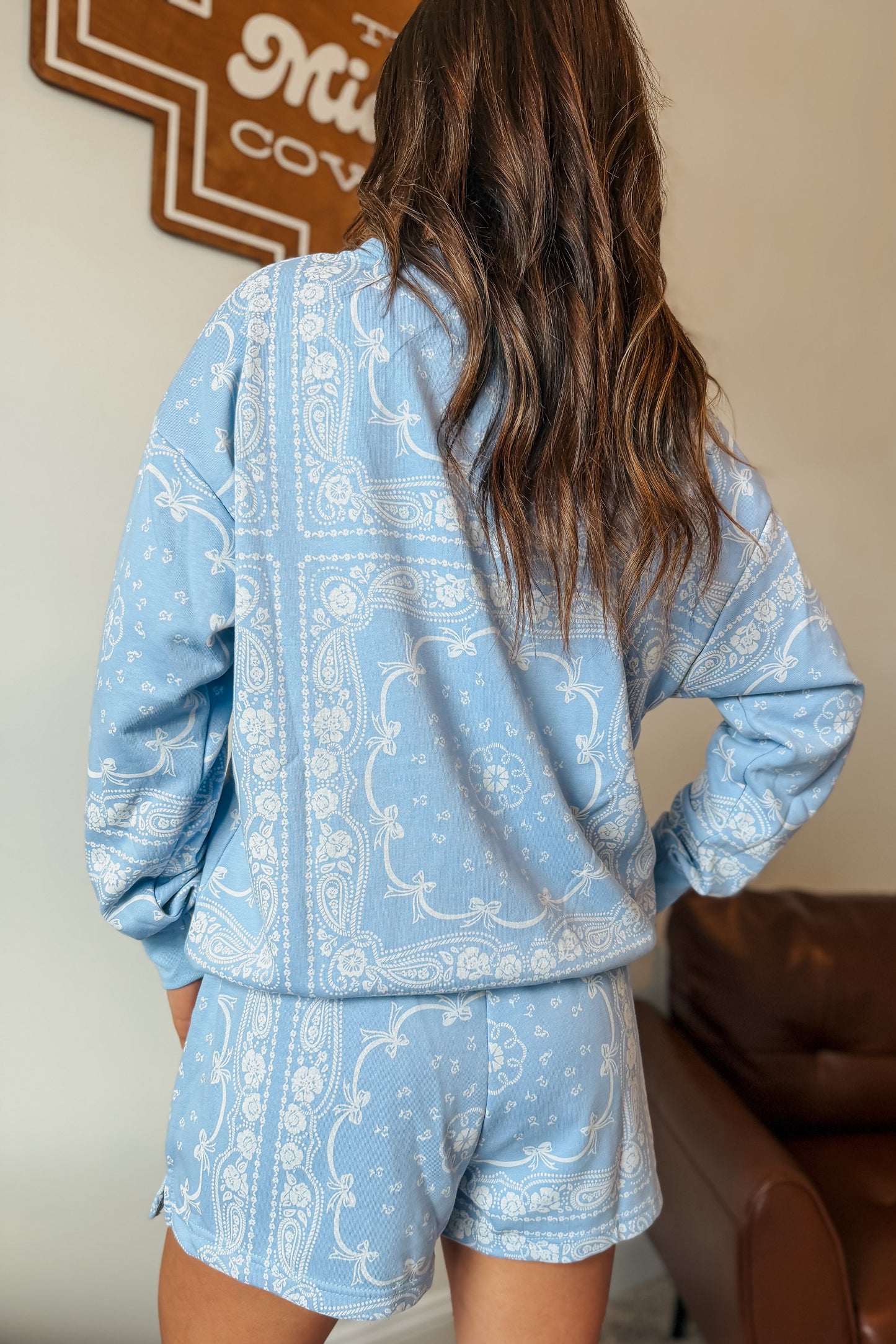 Back view of Periwinkle bandana print lounge set with bows, lace trim, and pocket sweatshirt.