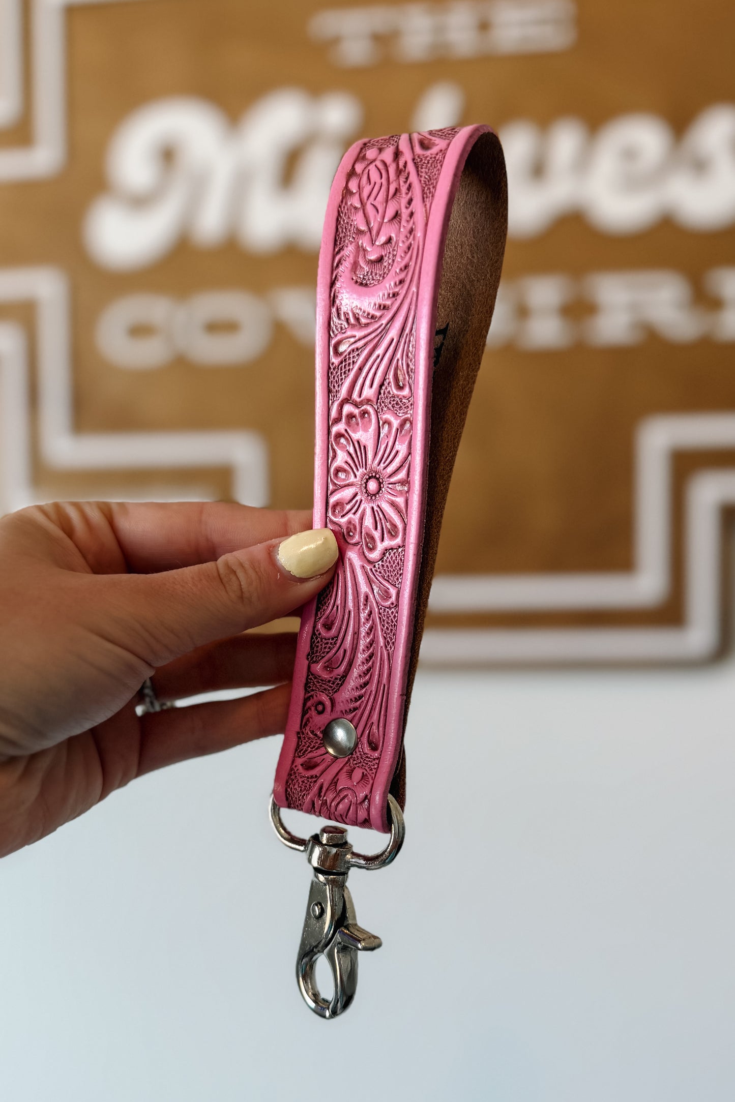 Pink tooled leather wristlet key fob.