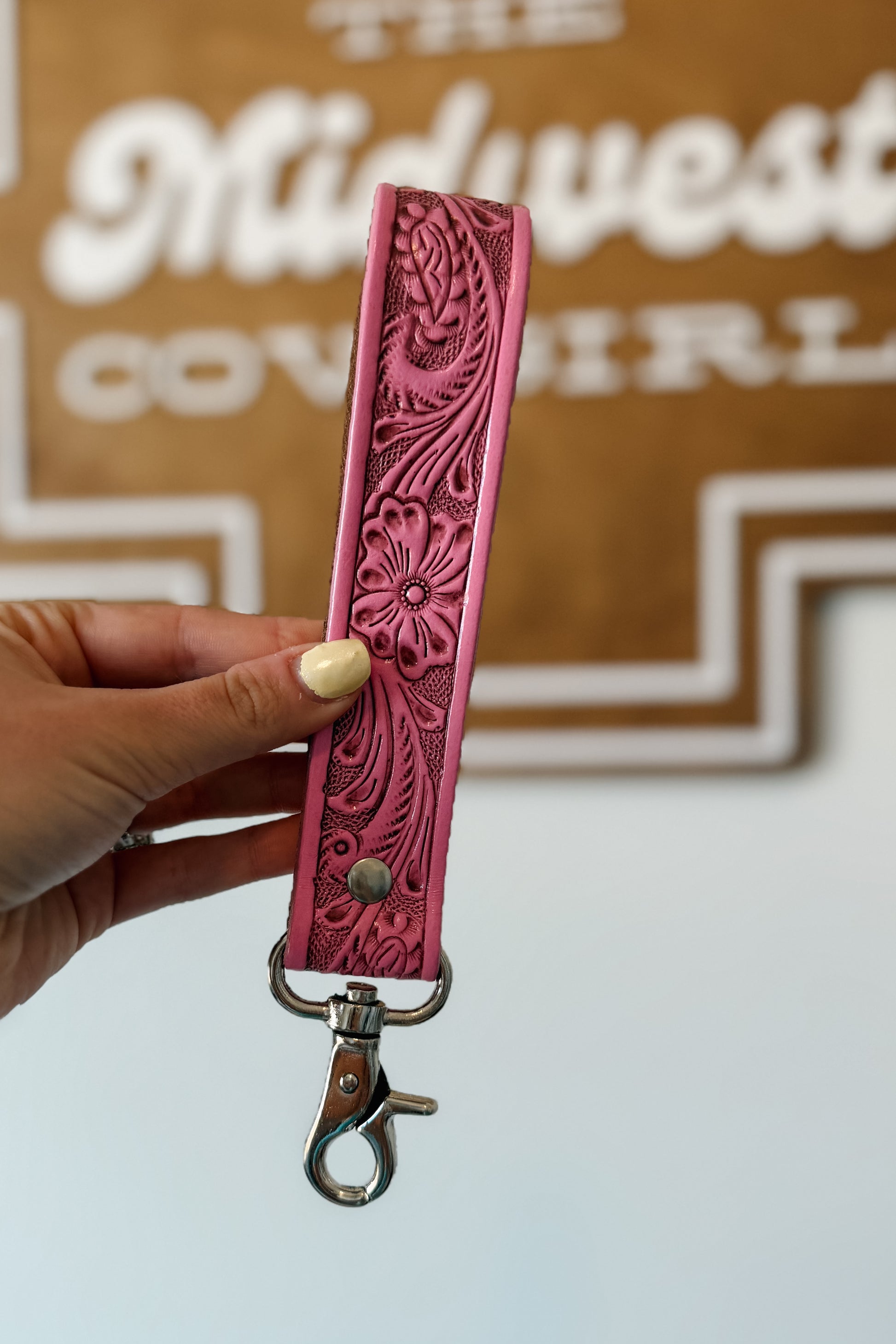 Pink tooled leather wristlet key fob.