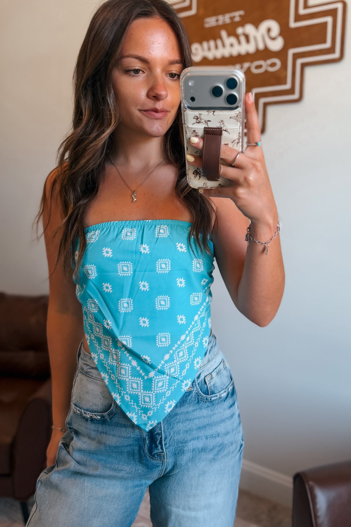 Turquoise bandanna-print tube top with V-shaped front.