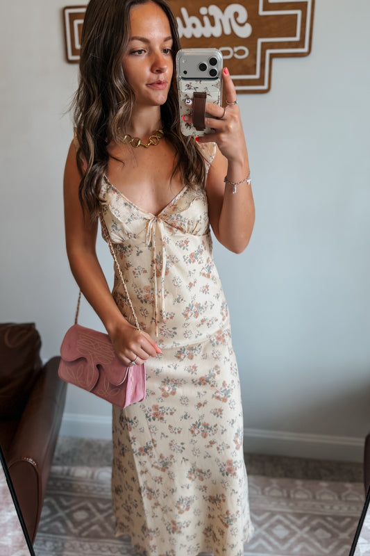 Front view of butter yellow floral midi dress with ruffle tank-style spaghetti straps.