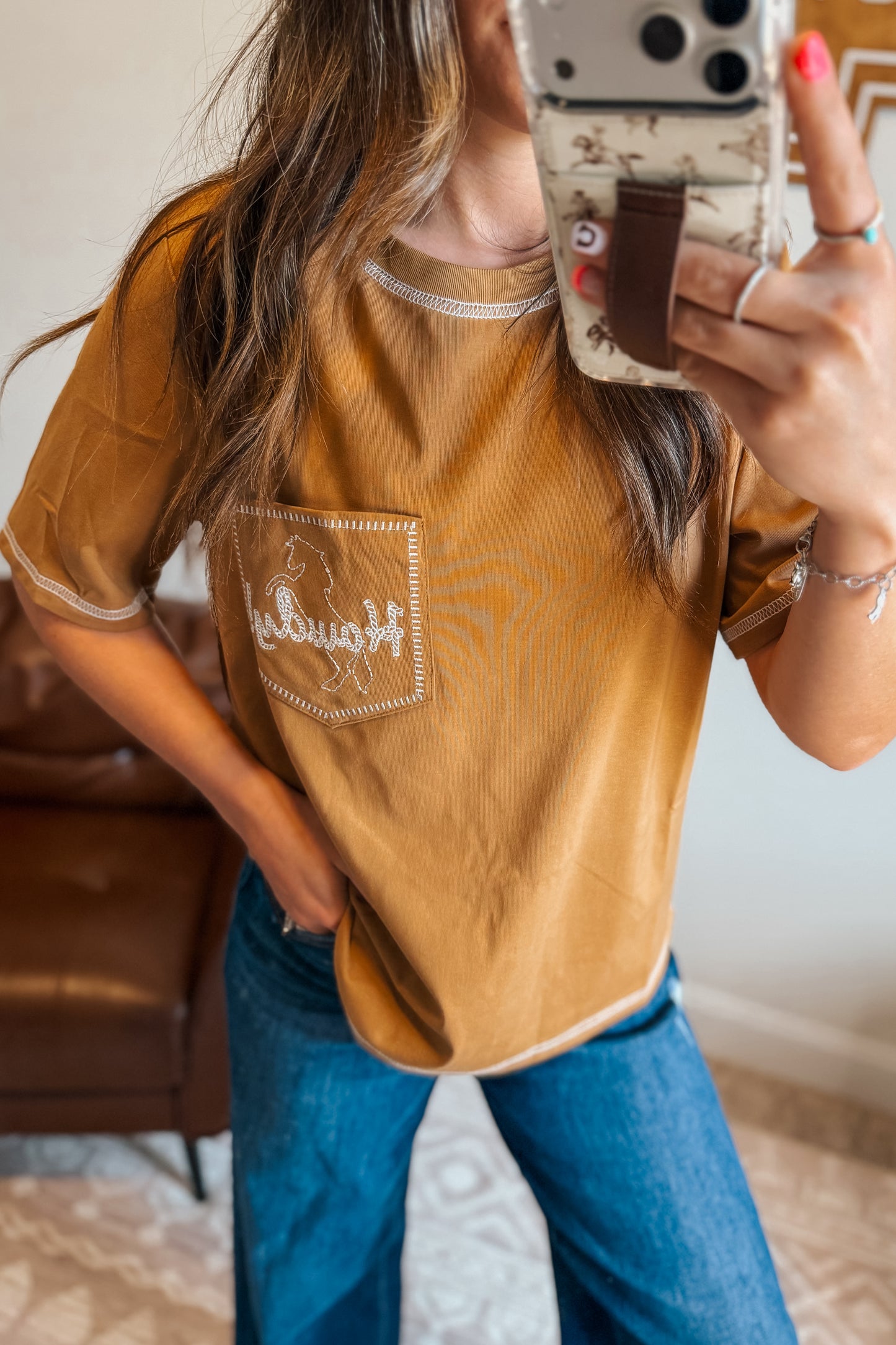 Camel tee with pocket and “Howdy” embroidery.