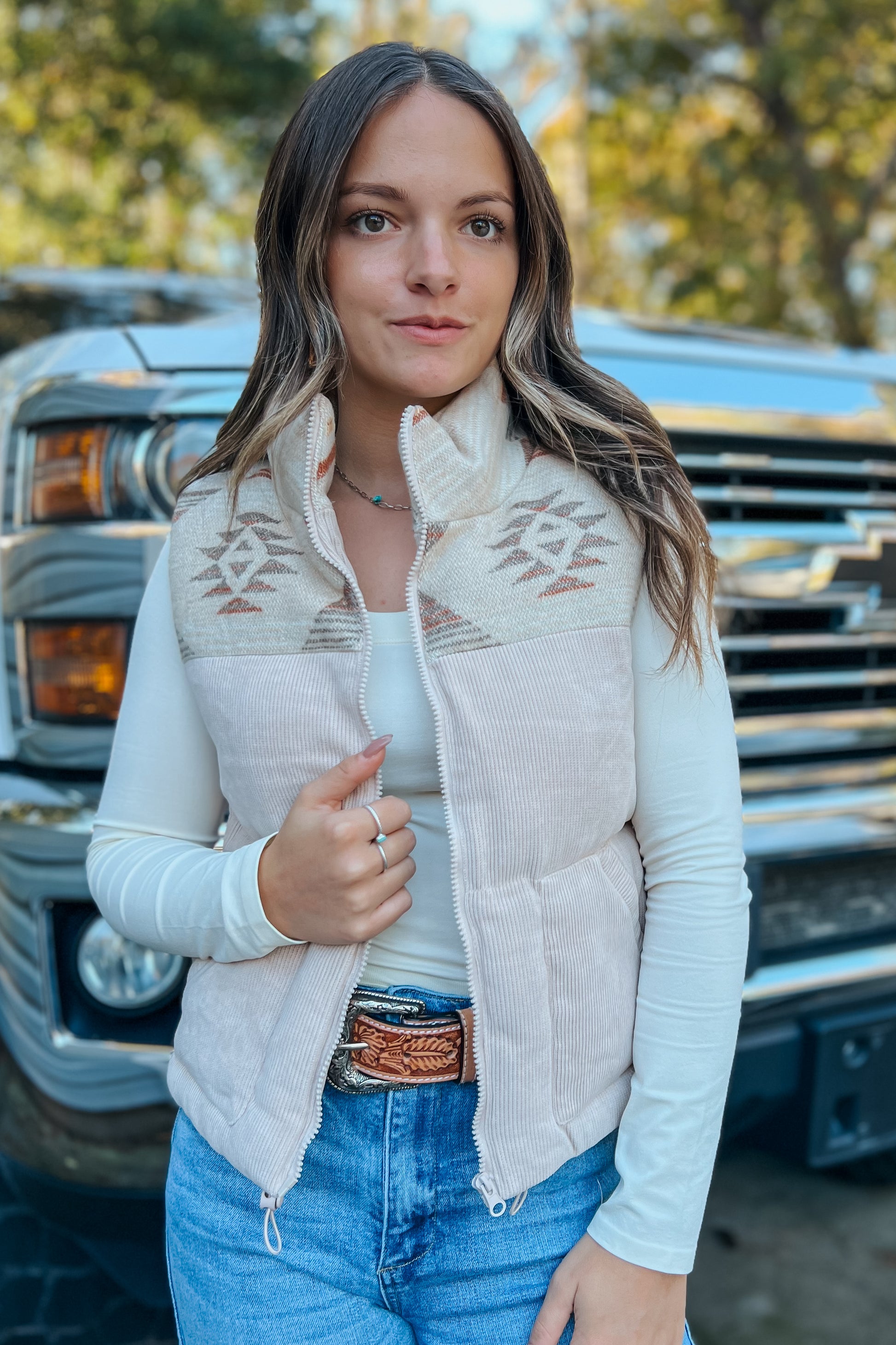 Close-up of adjustable side straps on Aztec corduroy puffer vest