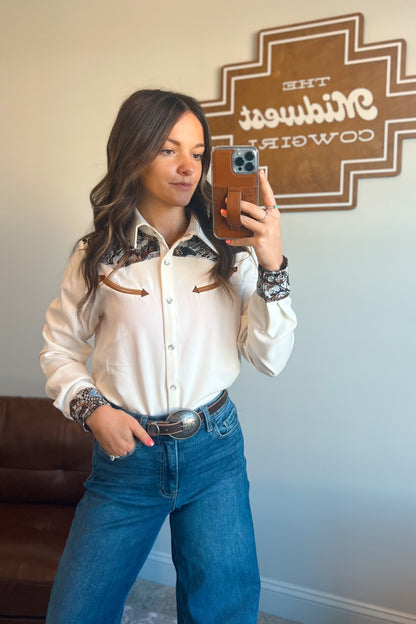 White long sleeve western snap button shirt with contrast southwestern print yoke across the shoulders and matching printed cuffs.