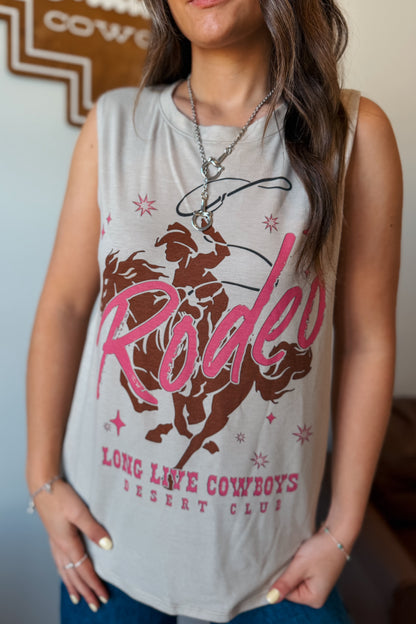 Cream flowy muscle tank featuring a western rodeo graphic on the front.