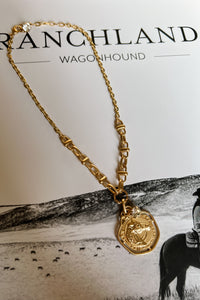 Matte gold chain necklace with a circle horse pendant