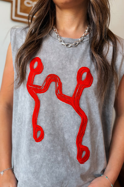 Gray mineral wash muscle tank with red curb bit embroidery.