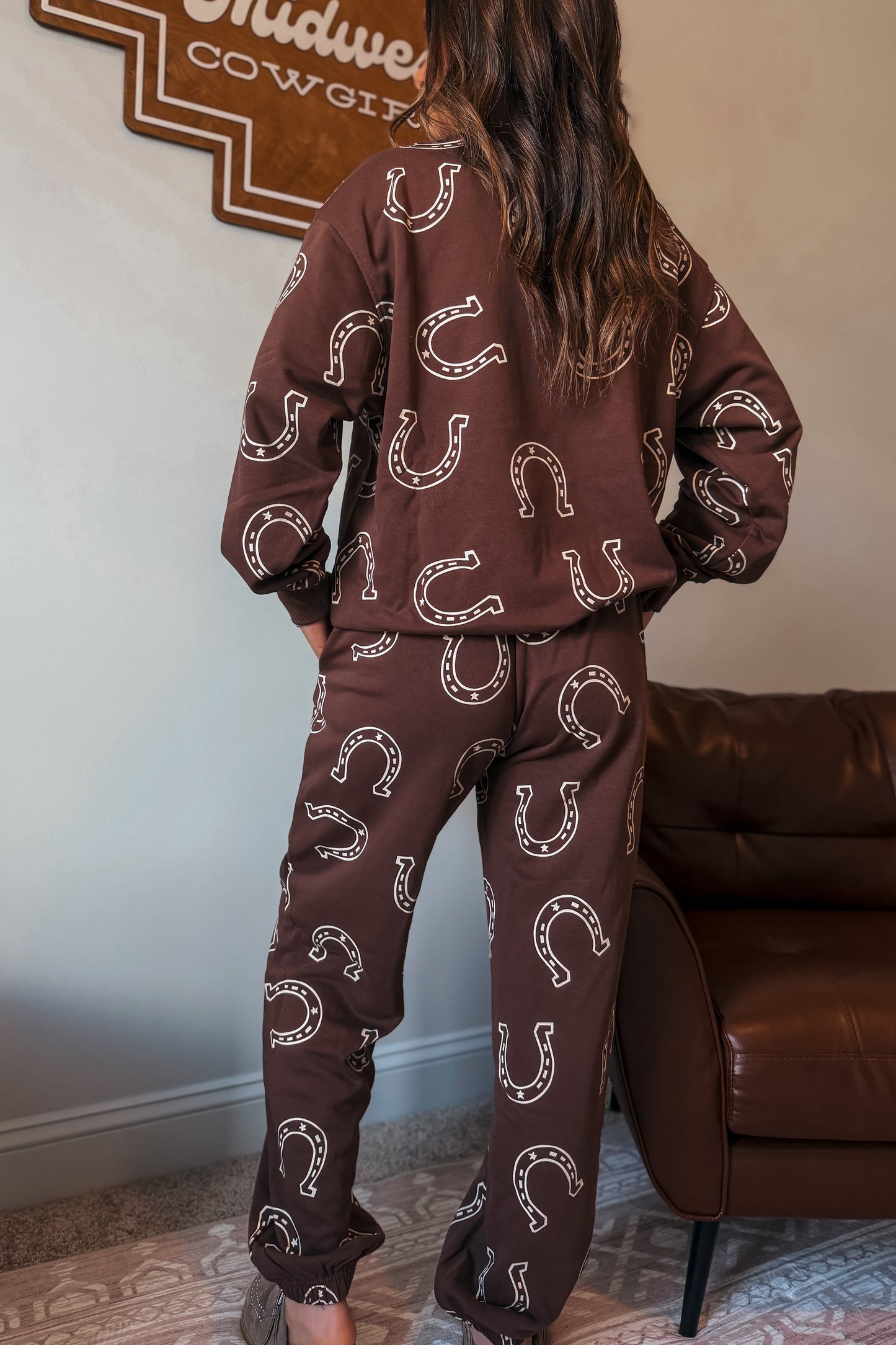 Brown sweatshirt and jogger pants set with white horseshoe print.