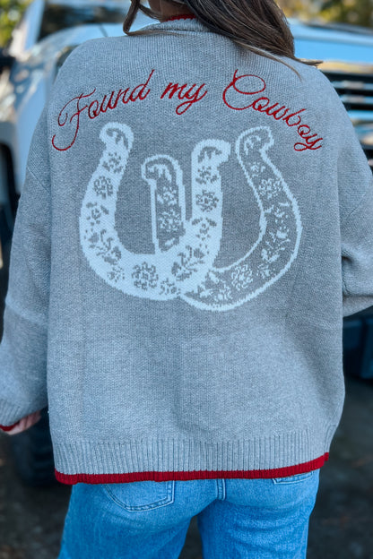 Close-up of cowboy embroidery on grey western cardigan