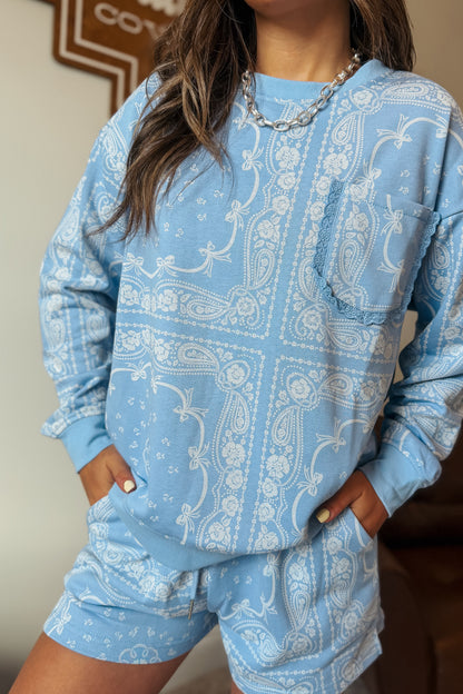Periwinkle bandana print lounge set with bows, lace trim, and pocket sweatshirt.