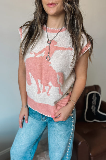 Model wearing western-inspired knit sweater vest with horse design in cream and pink tones