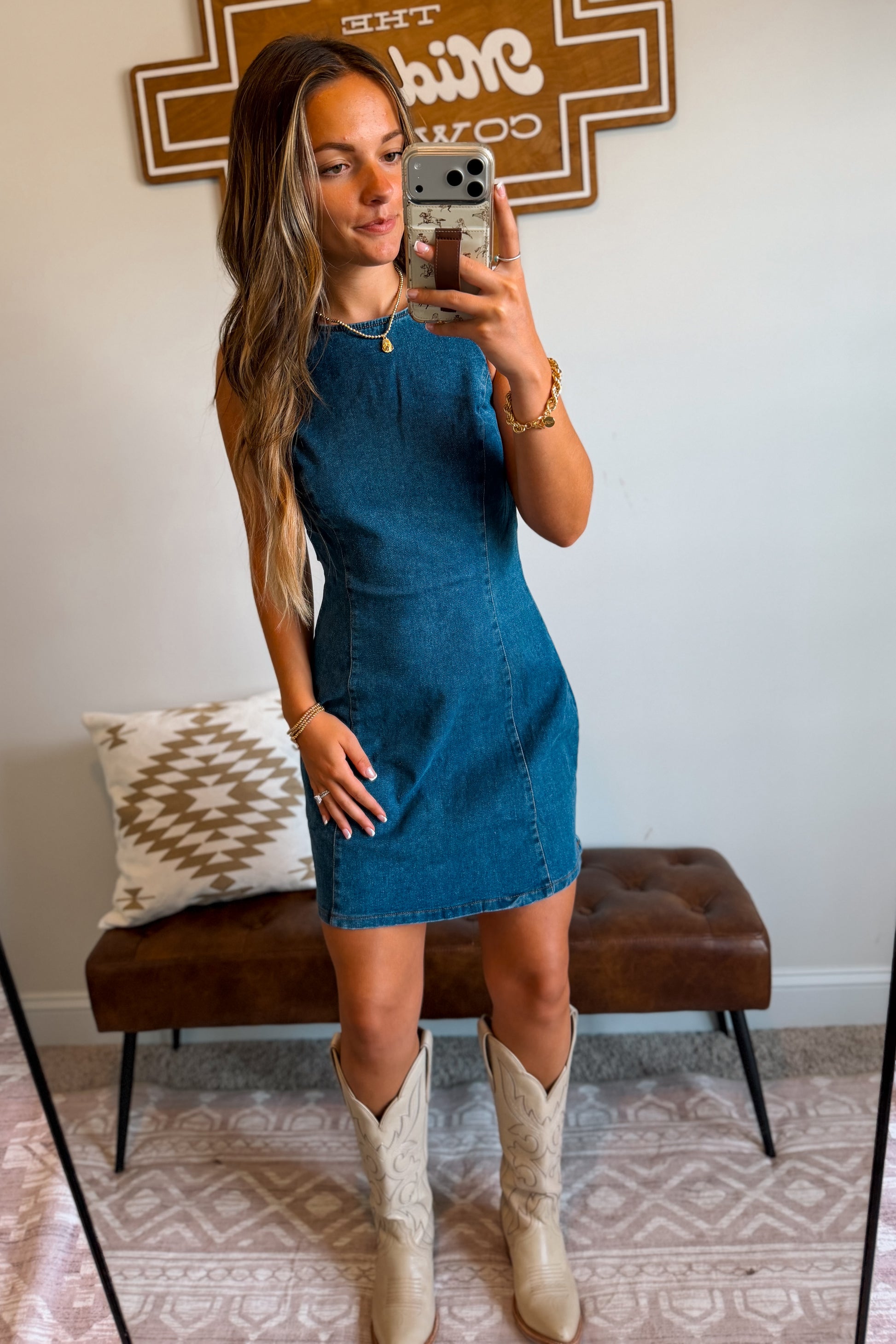     Women’s denim mini dress in a classic blue wash with a structured fit and above-the-knee length.
