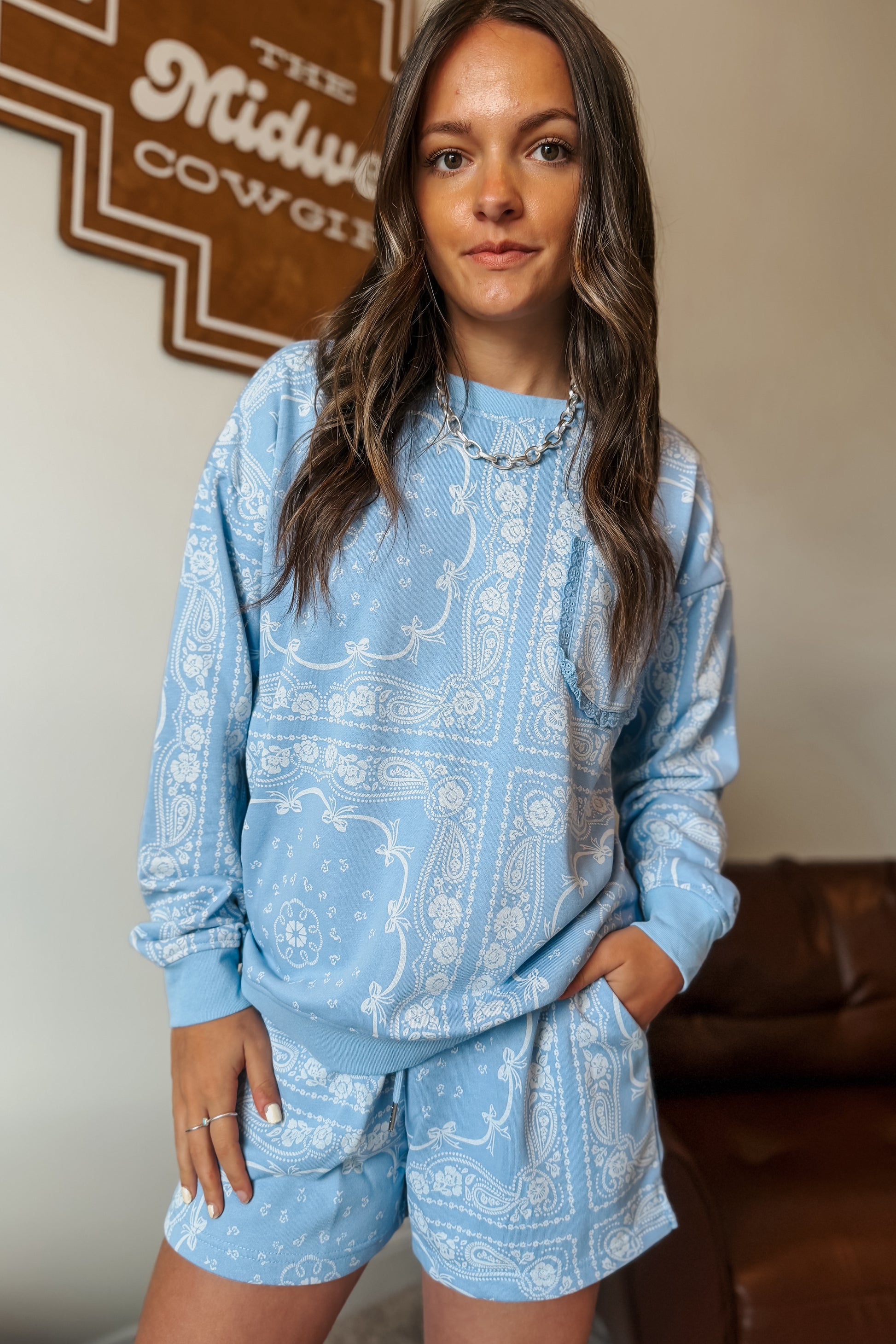 Periwinkle bandana print lounge set with bow details, lace trim, and a sweatshirt with front pocket.