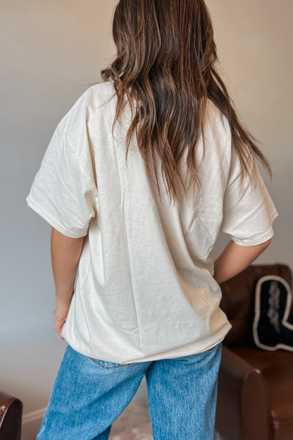 Back view of oversized western graphic t-shirt in cream color