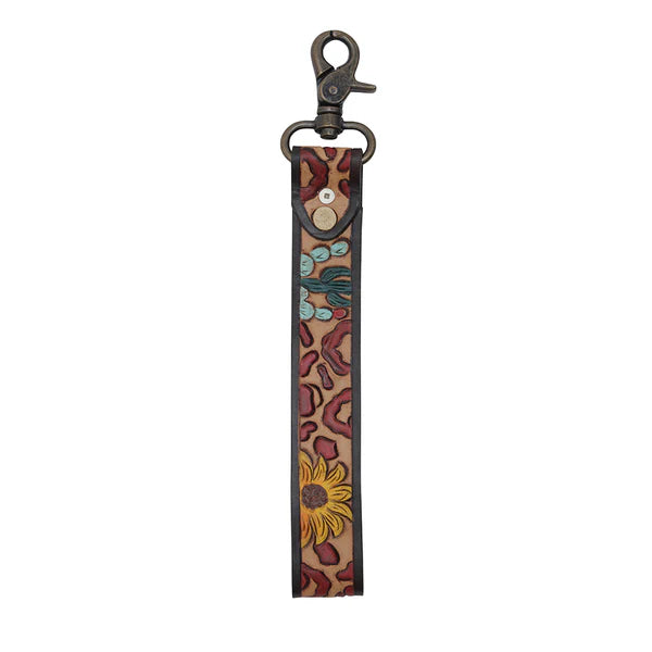 Western leather keychain wristlet with embroidered leopard, sunflower, and cactus design.