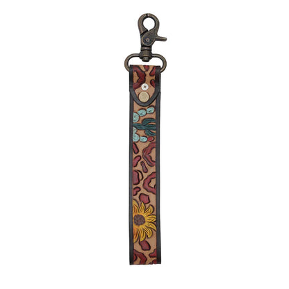Western leather keychain wristlet with embroidered leopard, sunflower, and cactus design.