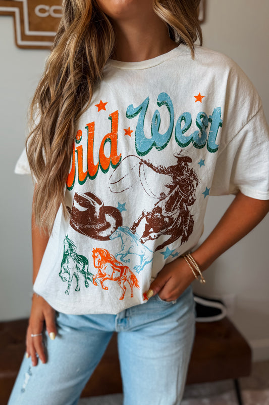 White graphic tee featuring a Wild West-inspired western design with cowboy and ranch-themed artwork.