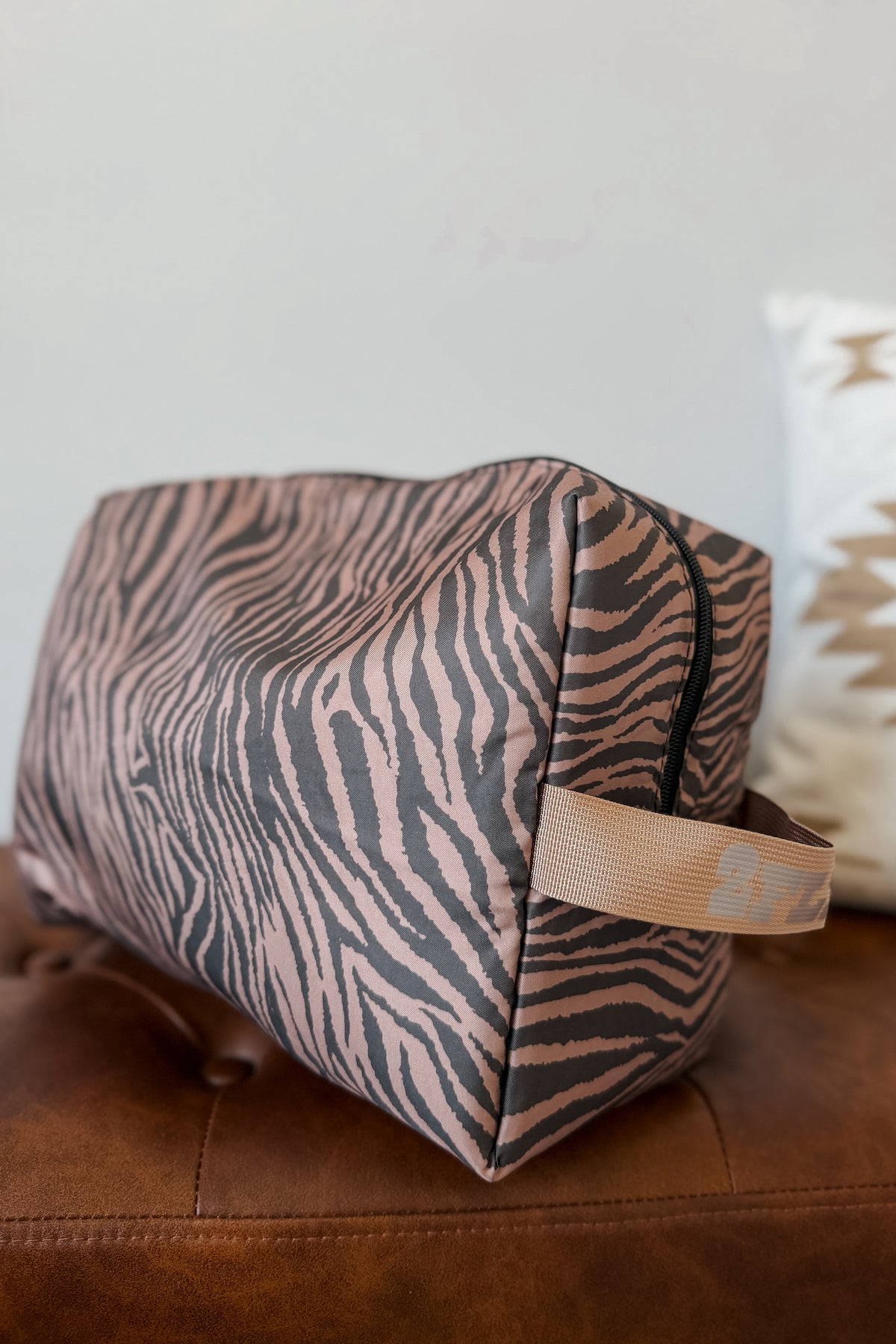 A cosmetic pouch with a zebra print pattern