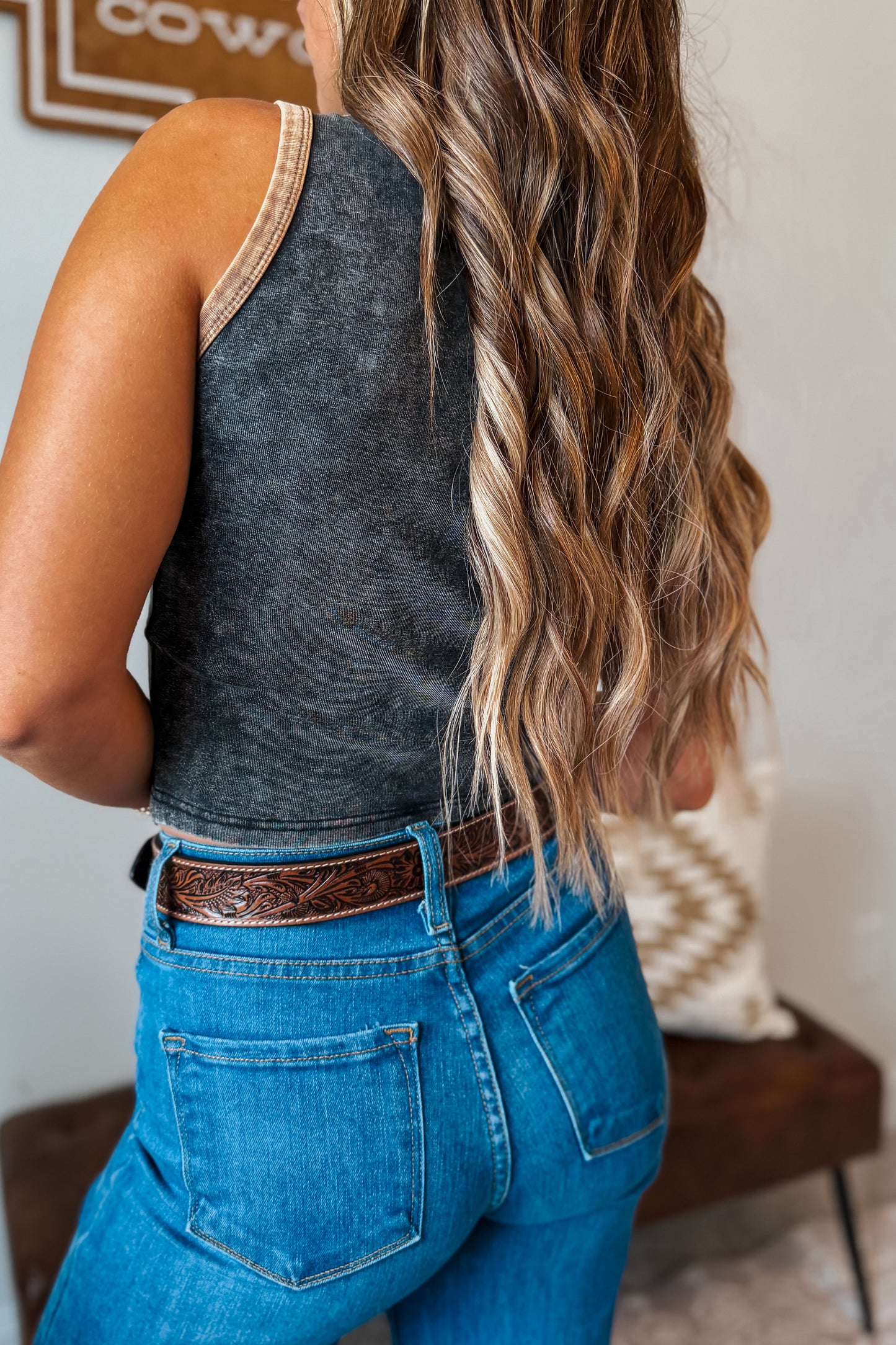 Back view of a gray mineral wash cropped tank top with tan contrast piping and a relaxed silhouette.
