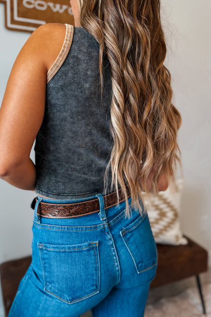 Back view of a gray mineral wash cropped tank top with tan contrast piping and a relaxed silhouette.

