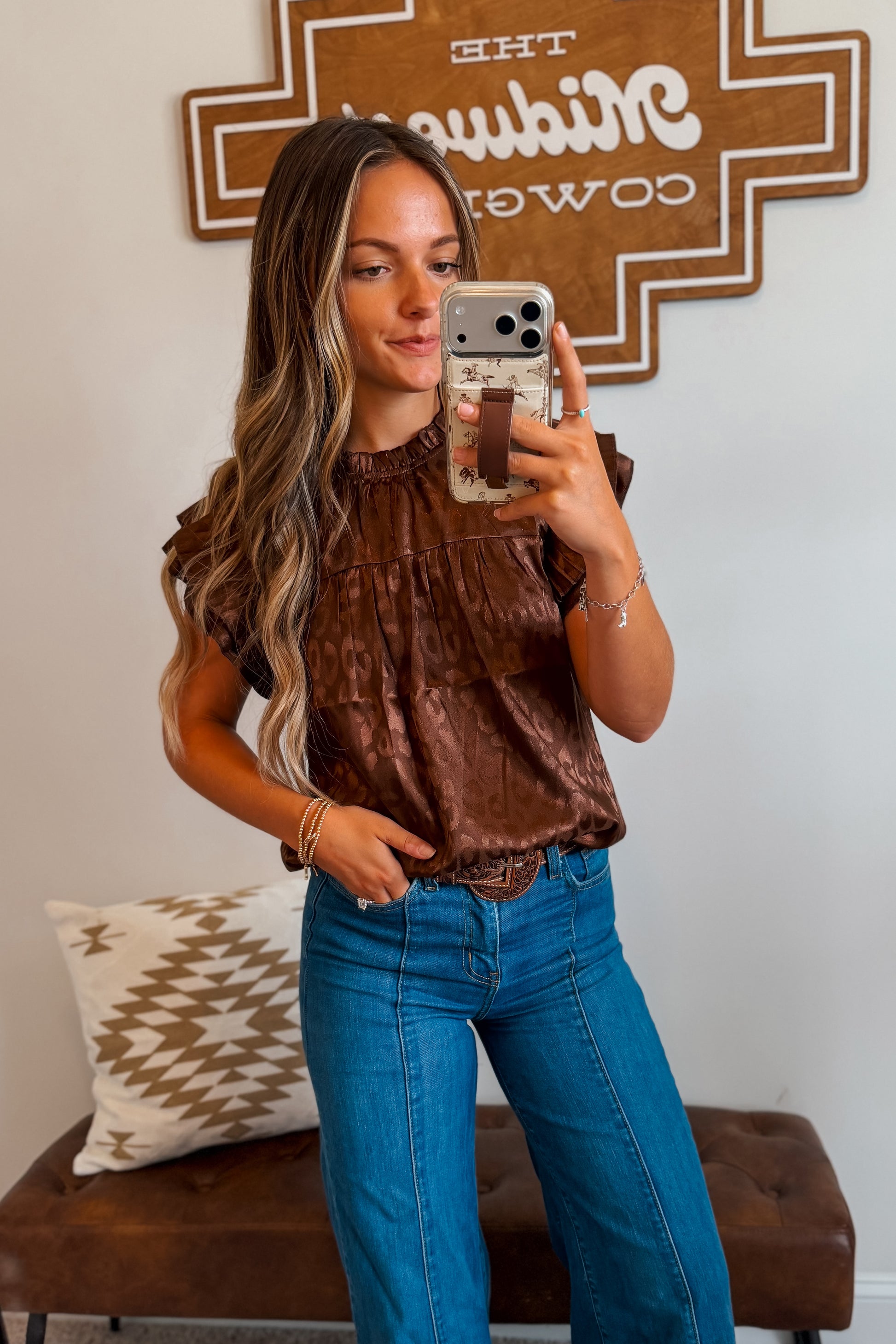 Brown leopard print top featuring layered ruffle sleeves and a relaxed silhouette. Designed with an allover leopard pattern for a bold western-inspired look.
