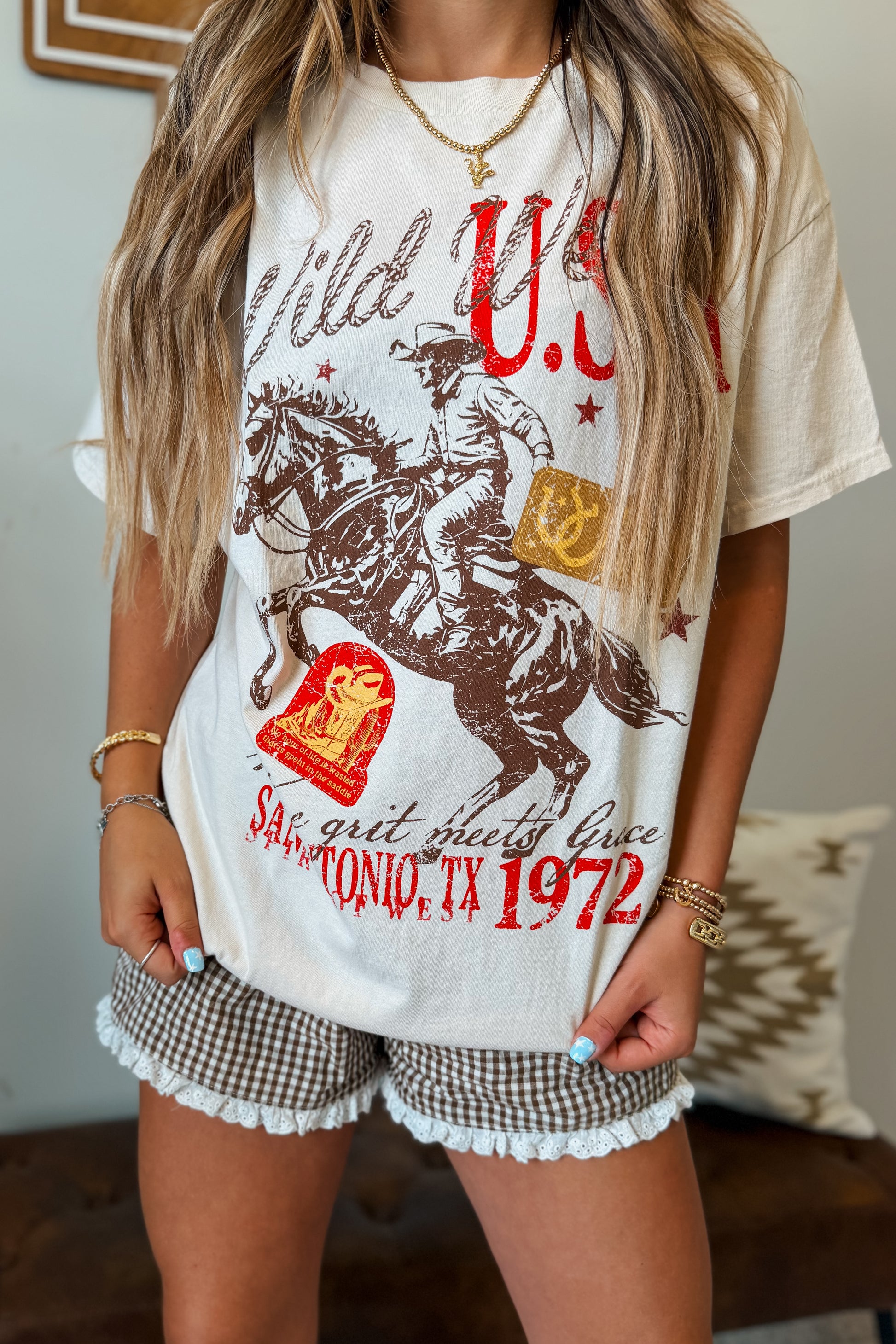 Front view of oversized Western graphic tee featuring a bold western-inspired design.