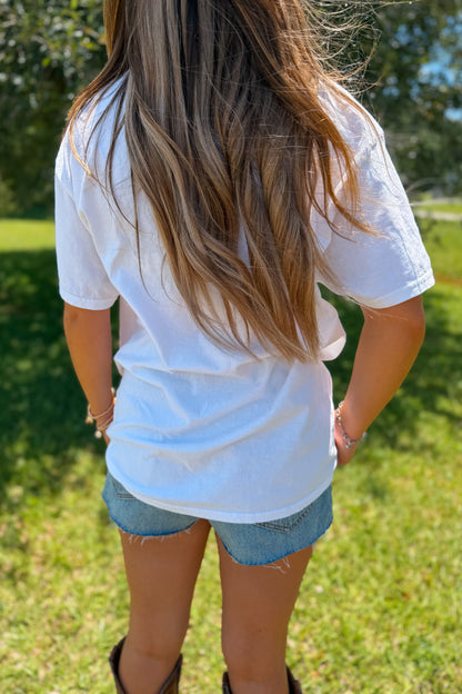 Back view of white American graphic tee with relaxed fit.

